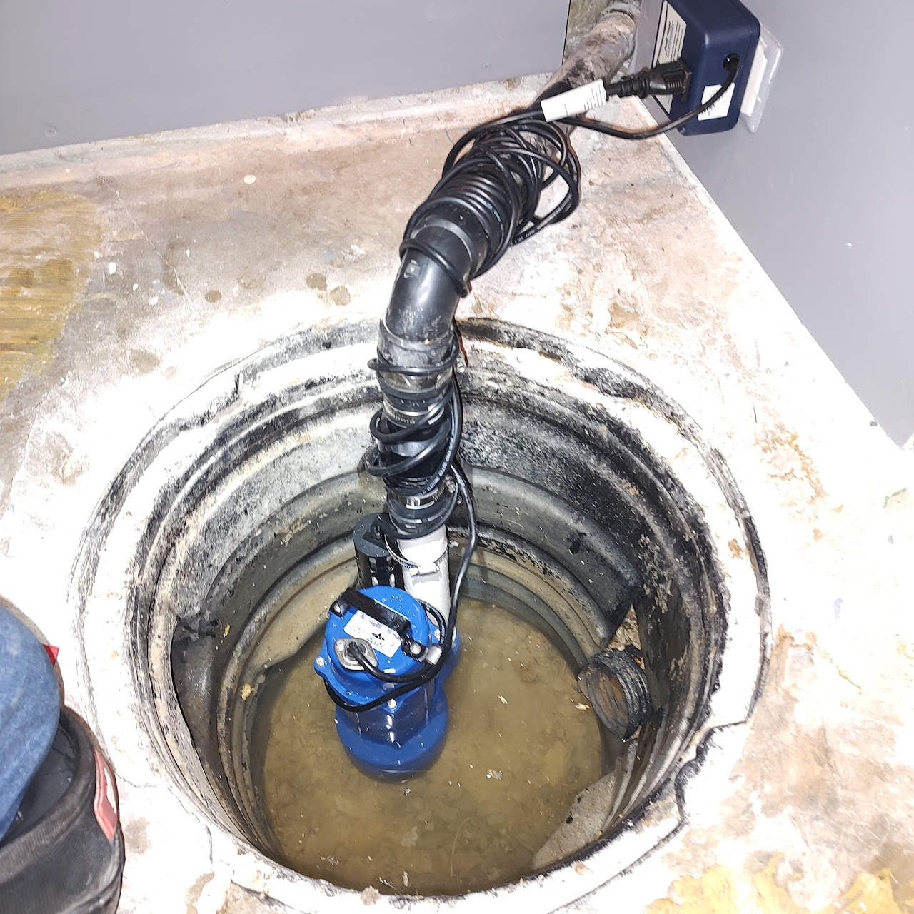 Professional sump pump installation to prevent basement flooding and ensure proper water drainage